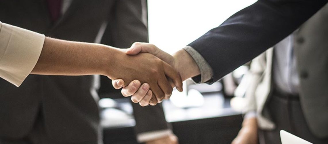 Business people shaking hands in a meeting room